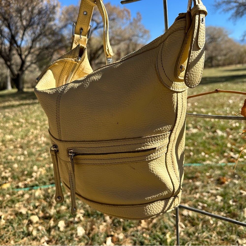 Adjustable faux leather purse.